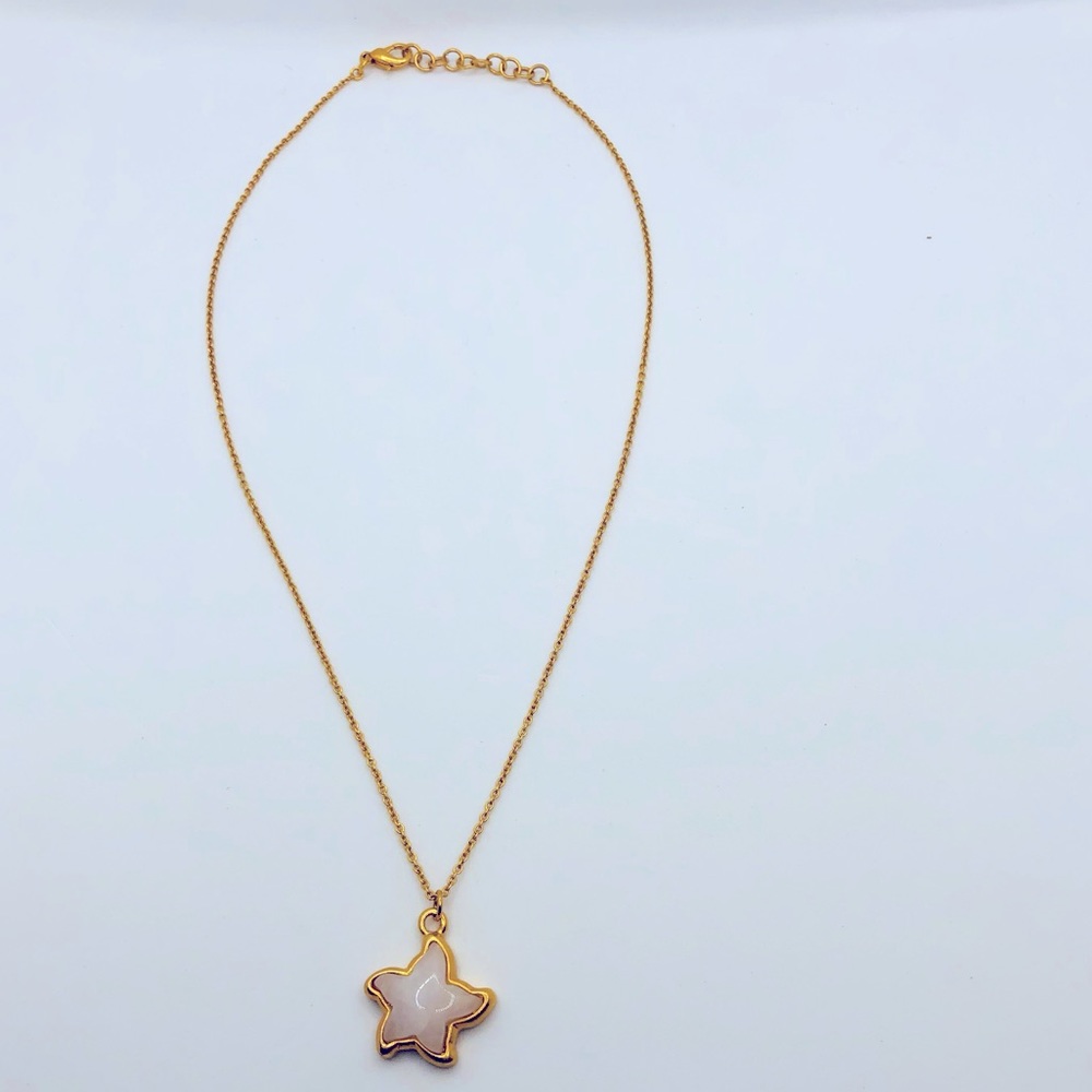 Unknown brand gold colored chain necklace with star like Jew.